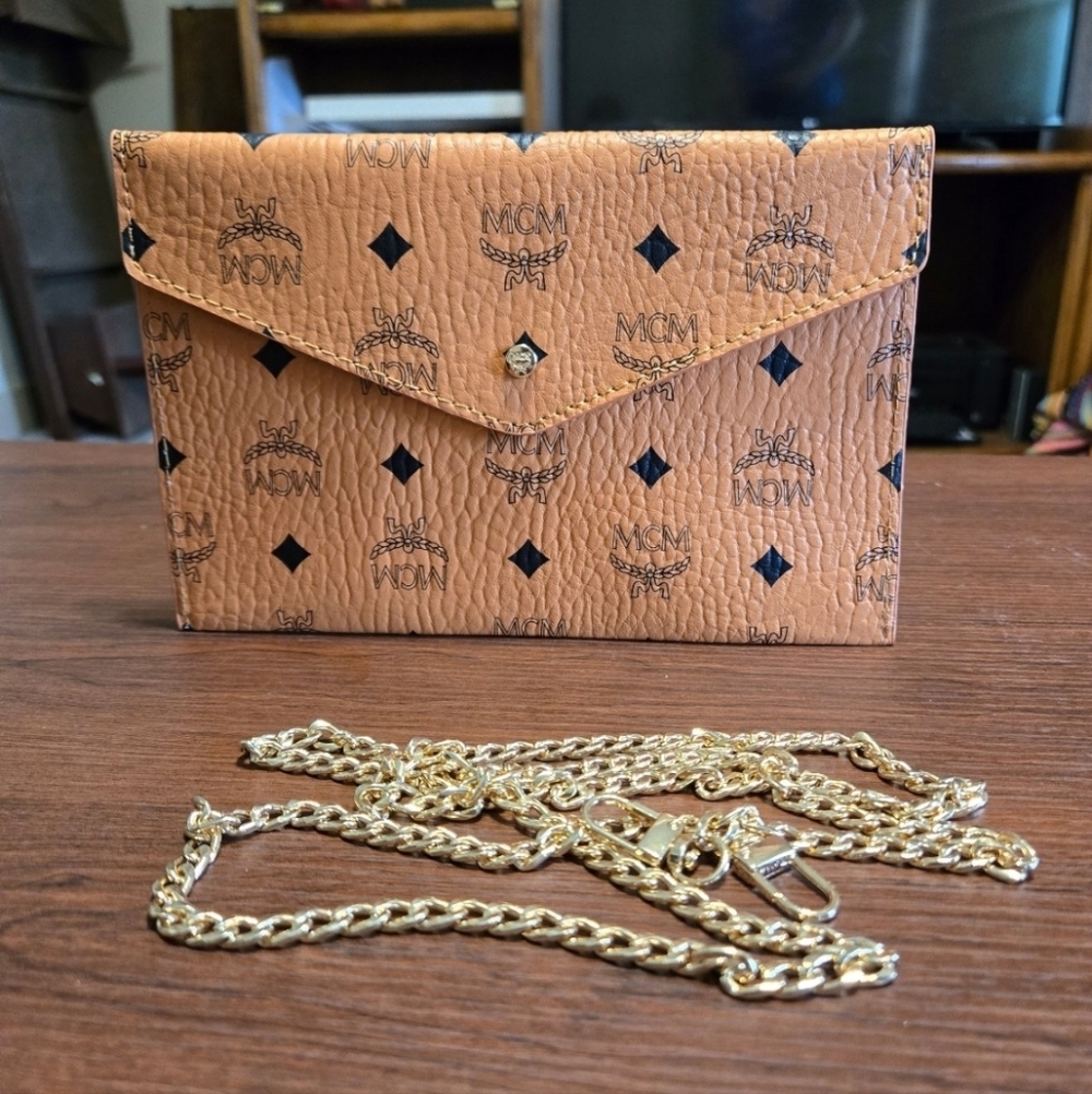 Brand new!! Brand new authentic MCM cognac clutch handbag